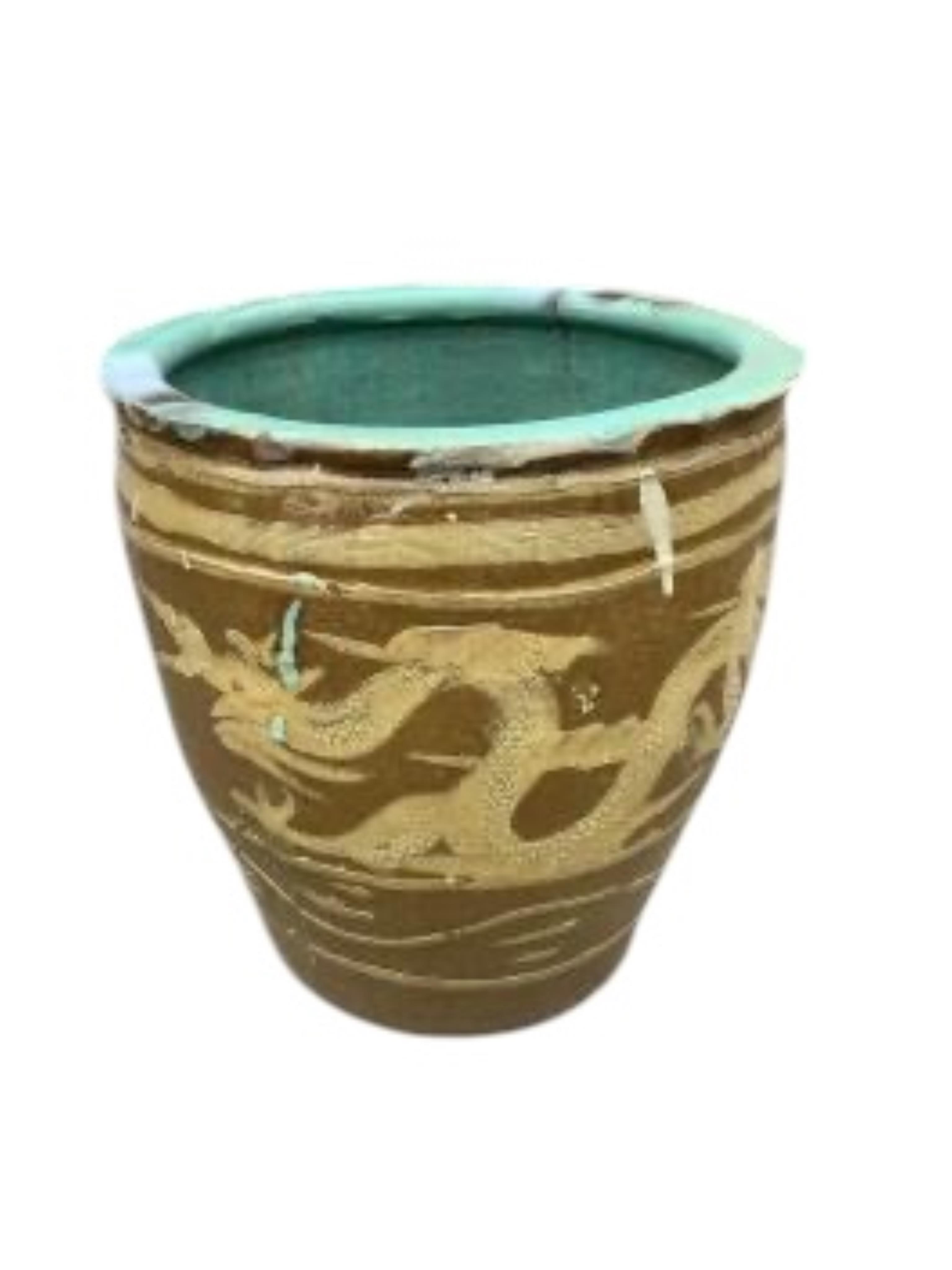 A pair of Chinese style circular earthenware garden planters, diameter 36cm, height 39cm